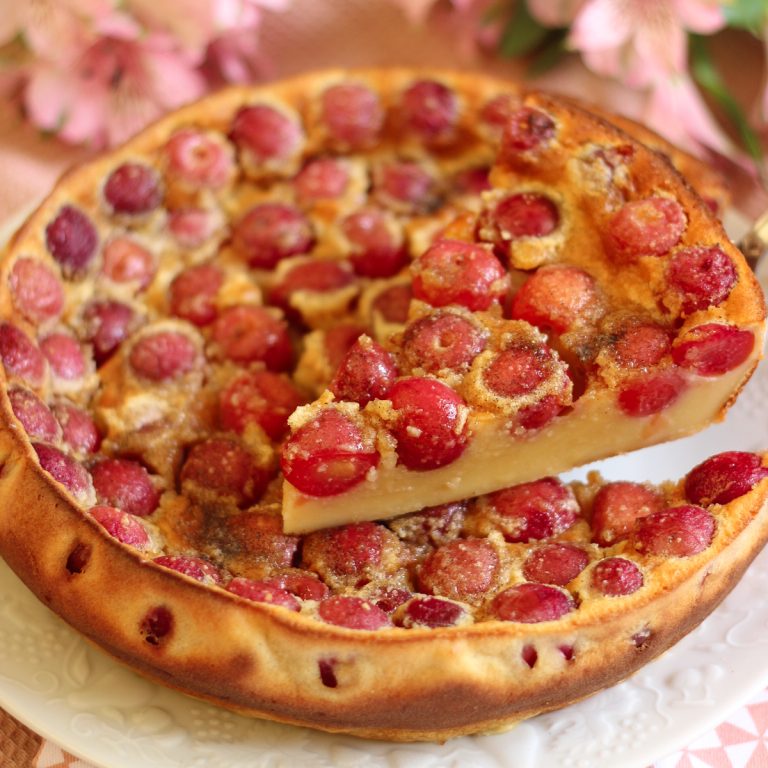 Cherry clafoutis on a white plate.