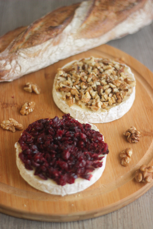 Camembert sliced in half and topped with chopped walnuts and dried cranberries before being wrapped in puff pastry.