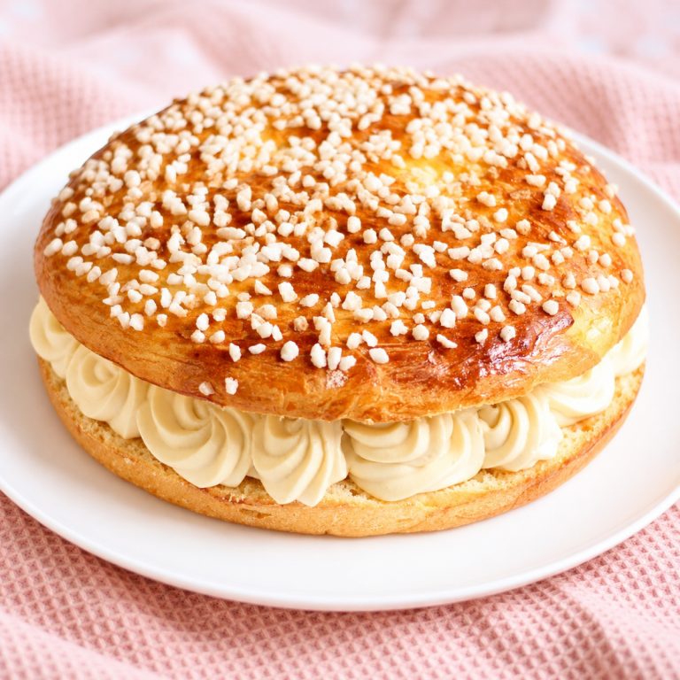 Homemade Tarte Tropézienne filled with orange blossom cream and topped with pearl sugar
